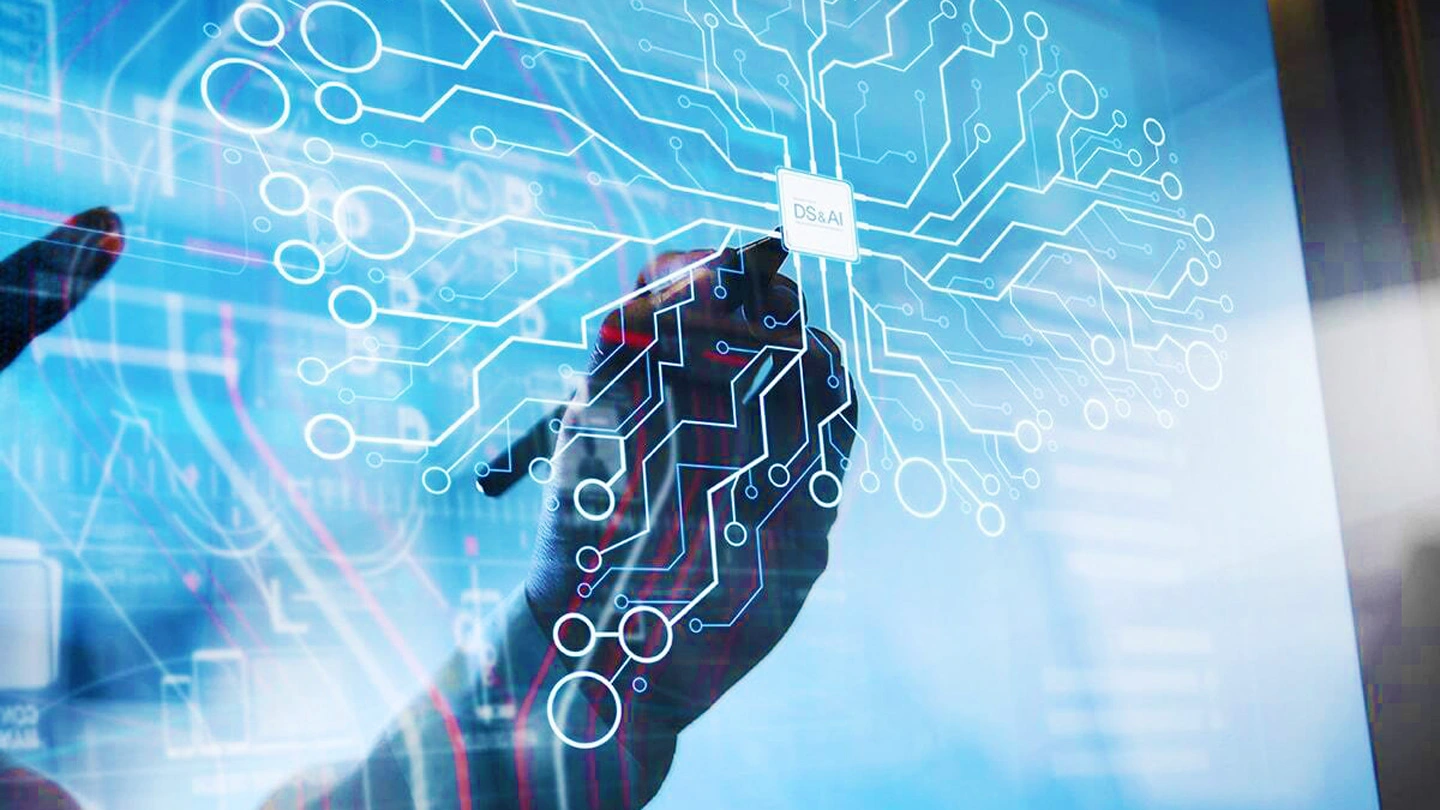 The hand holding the pen presses the “DS&AI” icon. A line of electrons spreads out from the icon.